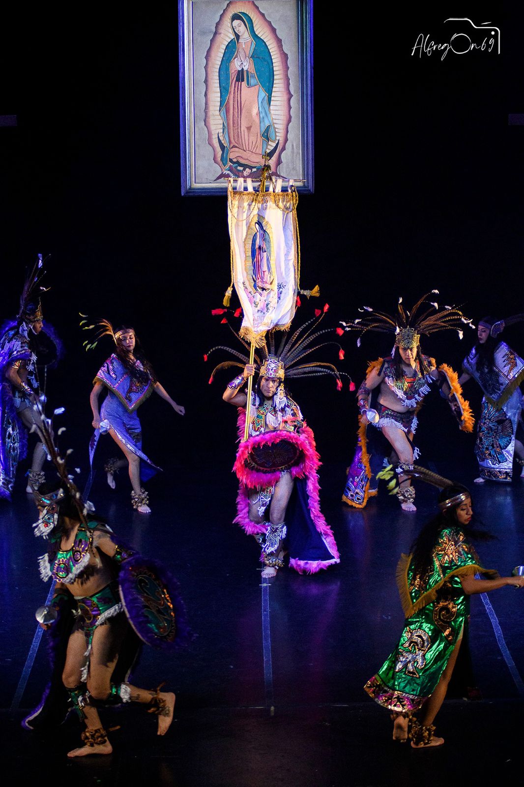 Energetic dance performance on a large stage.